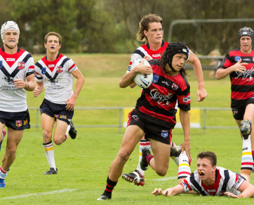 Tyrese Walker breaks away from the Roosters pack - NSW Rugby League Junior Representative Competition - Harold Matthews Cup Competition [U16] Round 3 - Central Coast Roosters Vs North Sydney - Morie Breen Reserve - 25/02/2017 Photos by - Steve Little - www.redandblackzone.com