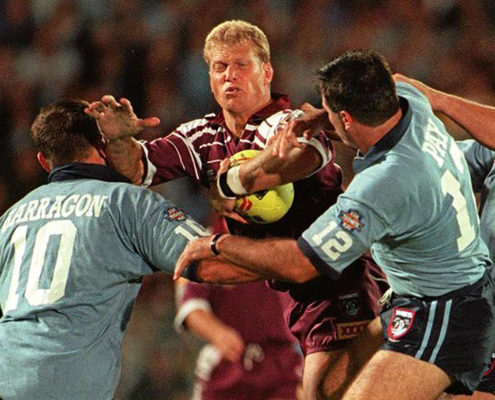 Image: GLORY YEARS: Gary Larson in attack against Paul Harragon and Dean Pay in Game I of the 1996 series. Geoff McLachlan